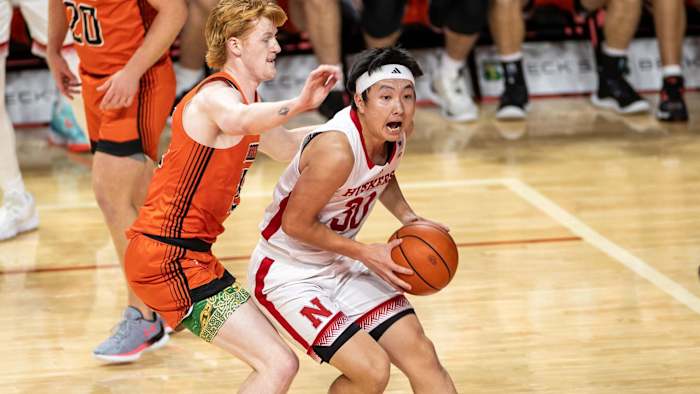 Nebraska guard Keisei Tominaga attacks the basket against Doane (Oct. 29, 2023)